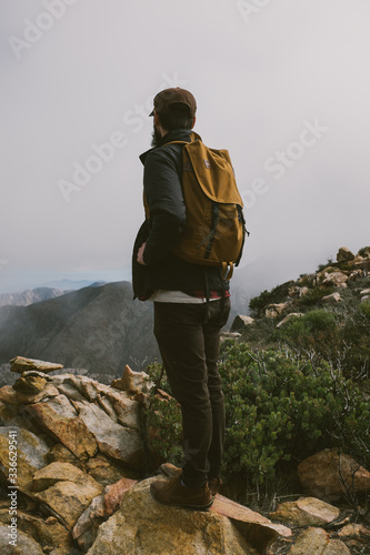 man overlooking mountains