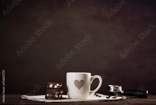 Coffee and utensils for coffee maker on dark brown background with copy space for text