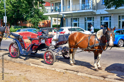 City tour in a horse-drawn carriage in Swinemünde. Swinoujscie, Poland