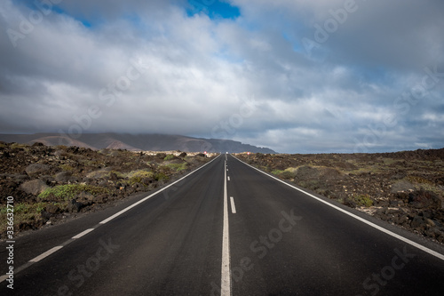 Volcanic landscape with road in Canary Island, Lanzarote.