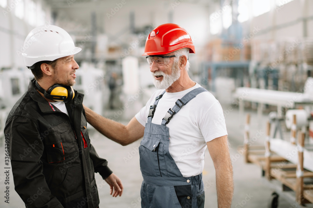 Colleagues working together. Workers in factory. Colleagues working together. Workers in factory.
