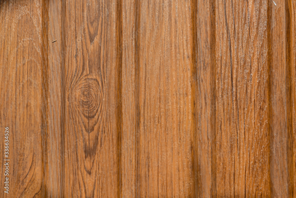 Obraz premium A sheet of metal roof tile with wood texture