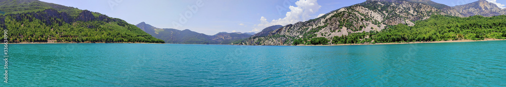 One of the main attractions of Turkey Green Canyon. Natural beauty of Turkey. Summer landscape with mountains and forest, turquoise lake. Beautiful mountain lake between rocks.