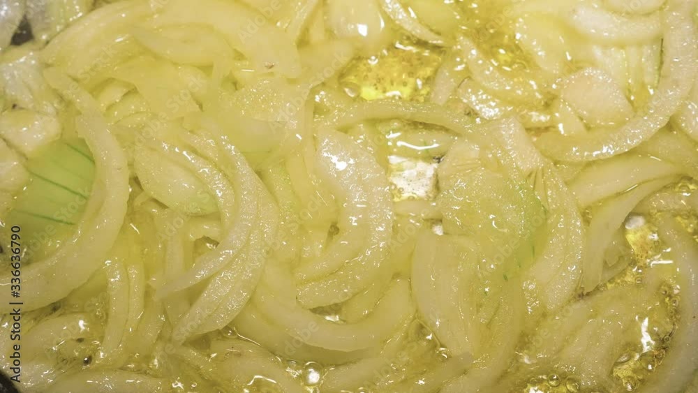 close up on fried onions in boiling oil close up on fried onions in boiling oil