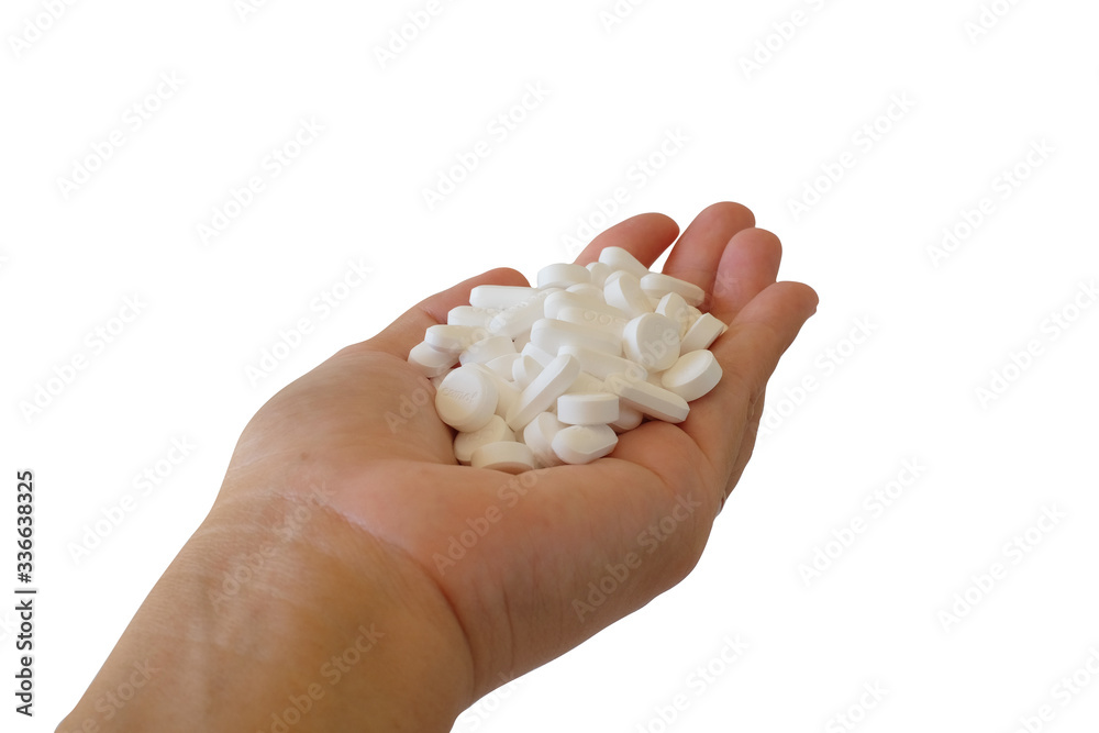 Close up a handful of medical tablets in palm hand. Paracetamol 500 mg. Medicine concept. Close up a handful of medical tablets in palm hand. Paracetamol 500 mg. Medicine concept.