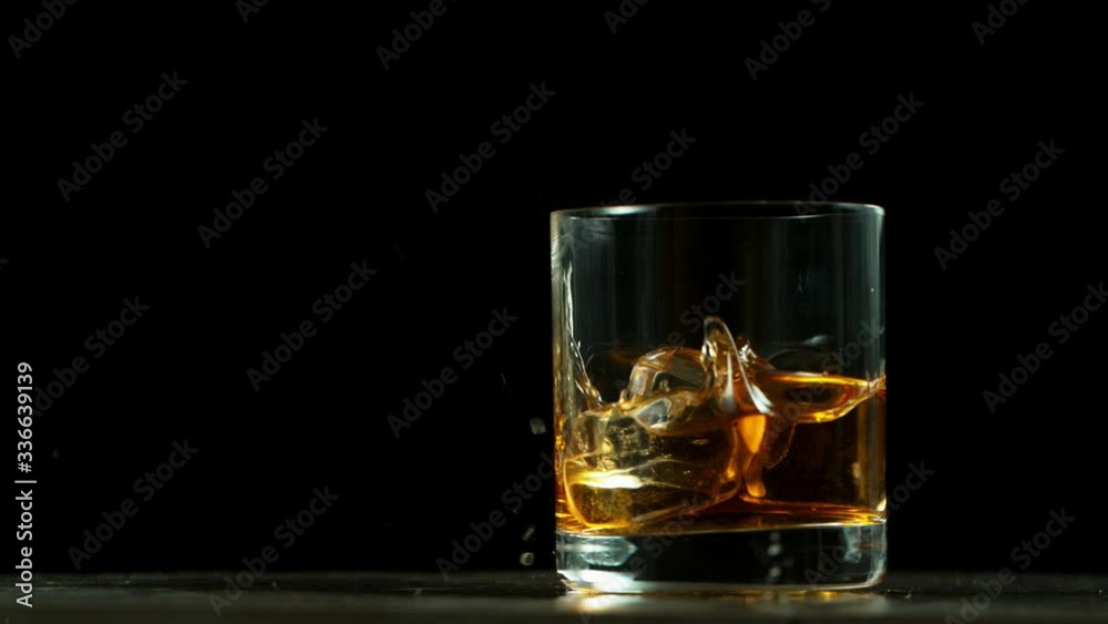 Super slow motion of falling glass of whiskey, being destructed. Filmed on high speed cinema camera, 1000 fps. Super slow motion of falling glass of whiskey, being destructed. Filmed on high speed cinema camera, 1000 fps.