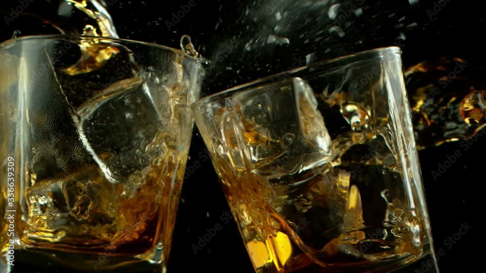 Super slow motion of 2 glasses of whiskey, being destructed. Filmed on high speed cinema camera, 1000 fps. Super slow motion of 2 glasses of whiskey, being destructed. Filmed on high speed cinema camera, 1000 fps.