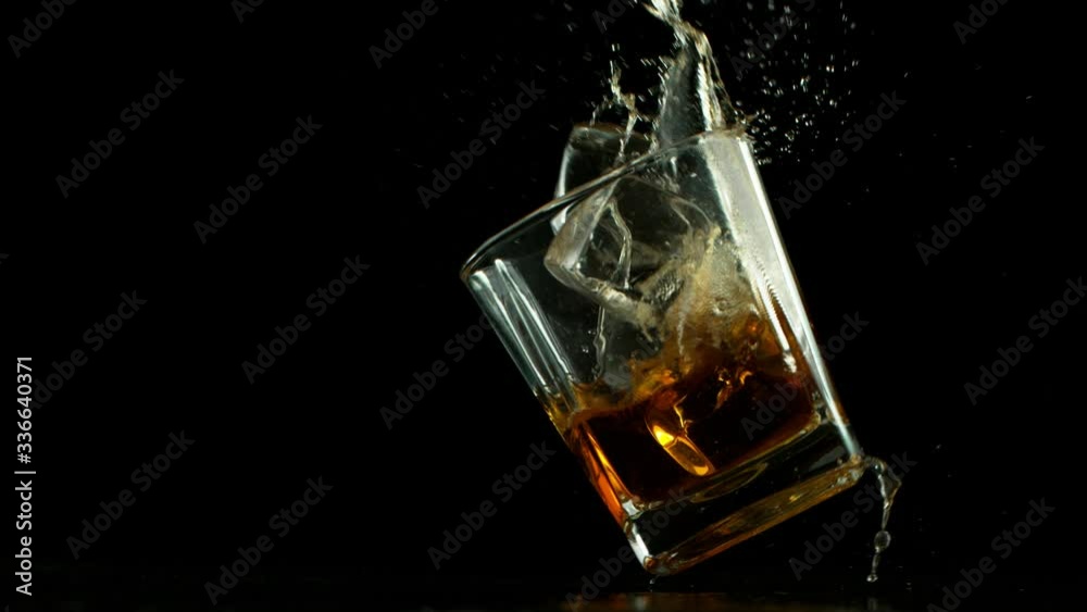 Super slow motion of falling glass of whiskey, being destructed. Filmed on high speed cinema camera, 1000 fps. Super slow motion of falling glass of whiskey, being destructed. Filmed on high speed cinema camera, 1000 fps.