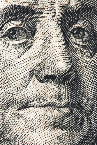 Close-up of one hundred bill Franklin portrait