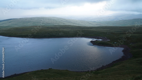 Llyn y Fan Fawr lake during dusk in Brecon Beacons National Park near Fan Brycheiniog, Wales, United Kingdom. photo