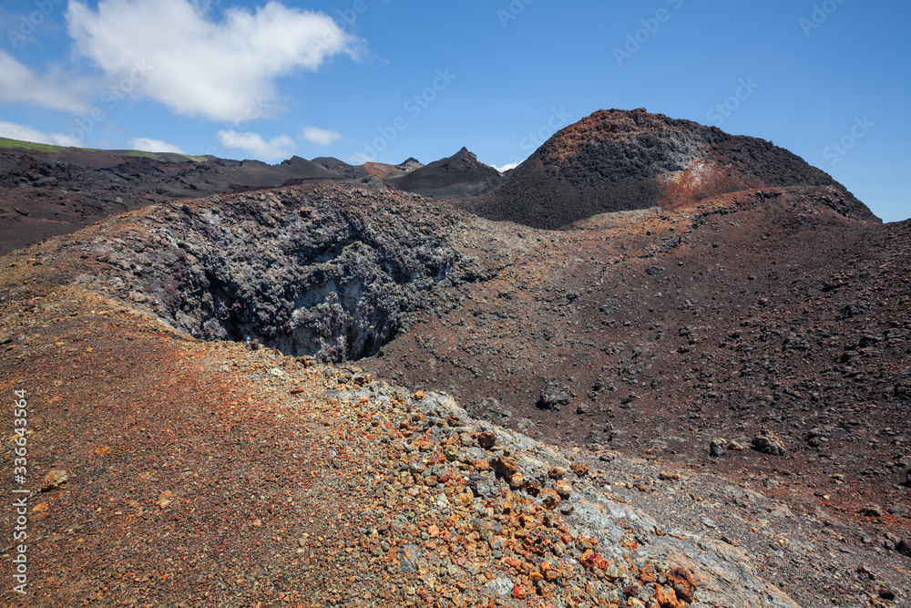 Lava fields and colorful minerals after eruption sierra negra caldera volcano chiko