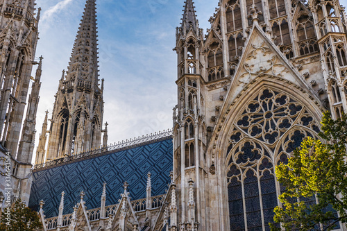 Votivkirche famous gothic church facade and blue sky in Vienna, Austria photo