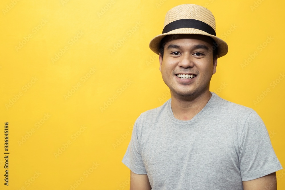 Handsome men in a good mood, bright yellow background room