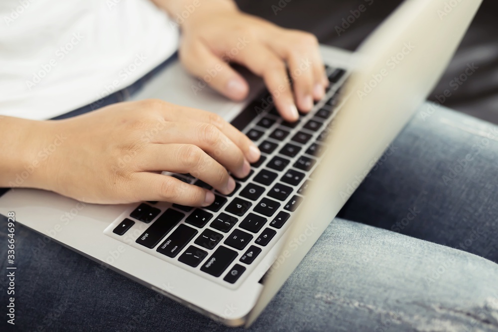 Woman is using a notebook computer to make purchases online at home, work for home Woman is using a notebook computer to make purchases online at home, work for home