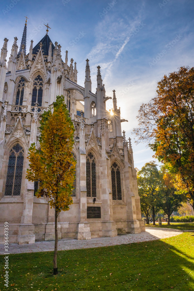 Gothic Votivkirche church and colorful autumn trees in Vienna, Austria
