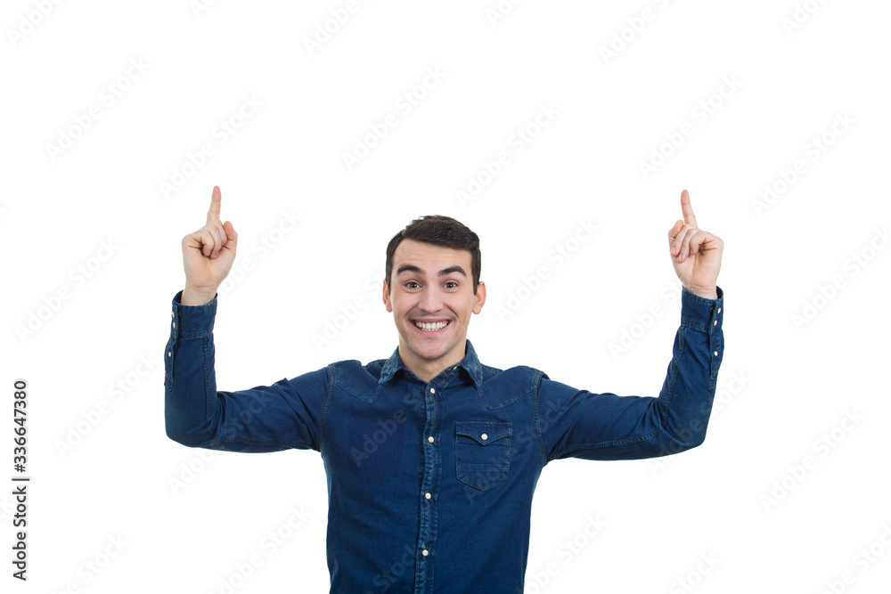 Excited man pointing up over white background. Smiling young man pointing up with a new idea over white background. Excited man pointing up over white background. Smiling young man pointing up with a new idea over white background.