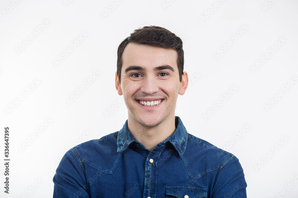Smiling excited young man isolated on white background. Close-up shot of Happy smiling student in shirt over white background.Happiness Smiling excited young man isolated on white background. Close-up shot of Happy smiling student in shirt over white background.Happiness