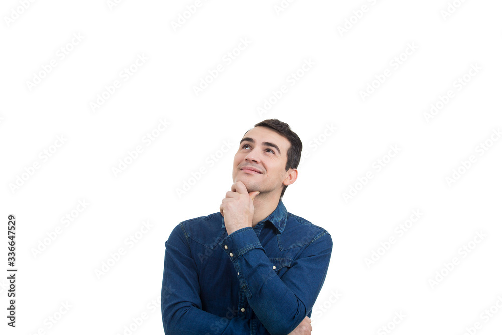 Smiling excited young man loking up and thinking over white background. Close-up shot of Happy smiling student in shirt over white background. Happiness Smiling excited young man loking up and thinking over white background. Close-up shot of Happy smiling student in shirt over white background. Happiness