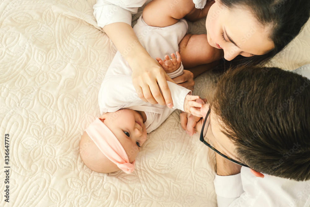 Happy young father, mother and cute baby Happy young father, mother and cute baby