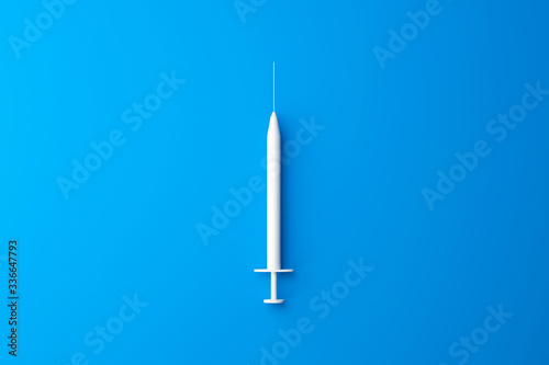 Top view of white medical syringe for injection to prevent and treat the virus on blue background with minimal concept. Vaccine needle or antibiotic. 3D rendering. © Lemonsoup14