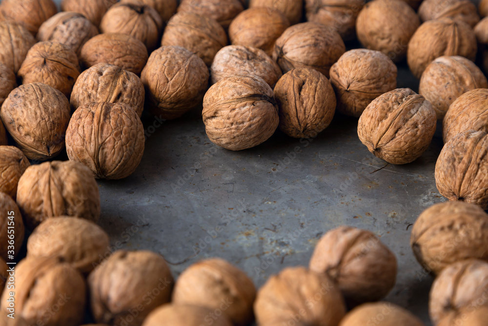 walnuts on a gray metal background walnuts on a gray metal background