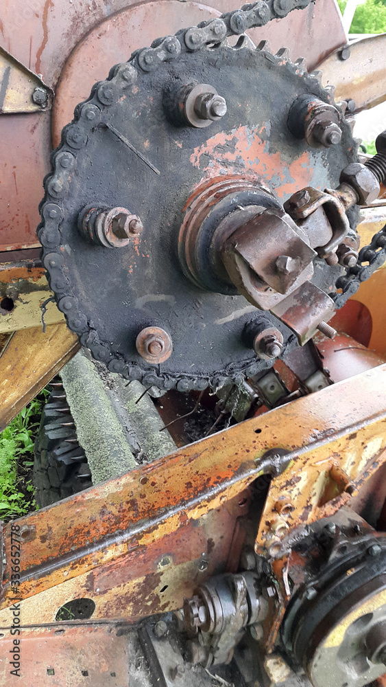 Mechanism. Old gear. Rusty parts. Mechanical device. Old gear with iron gears and pulleys Mechanism. Old gear. Rusty parts. Mechanical device. Old gear with iron gears and pulleys