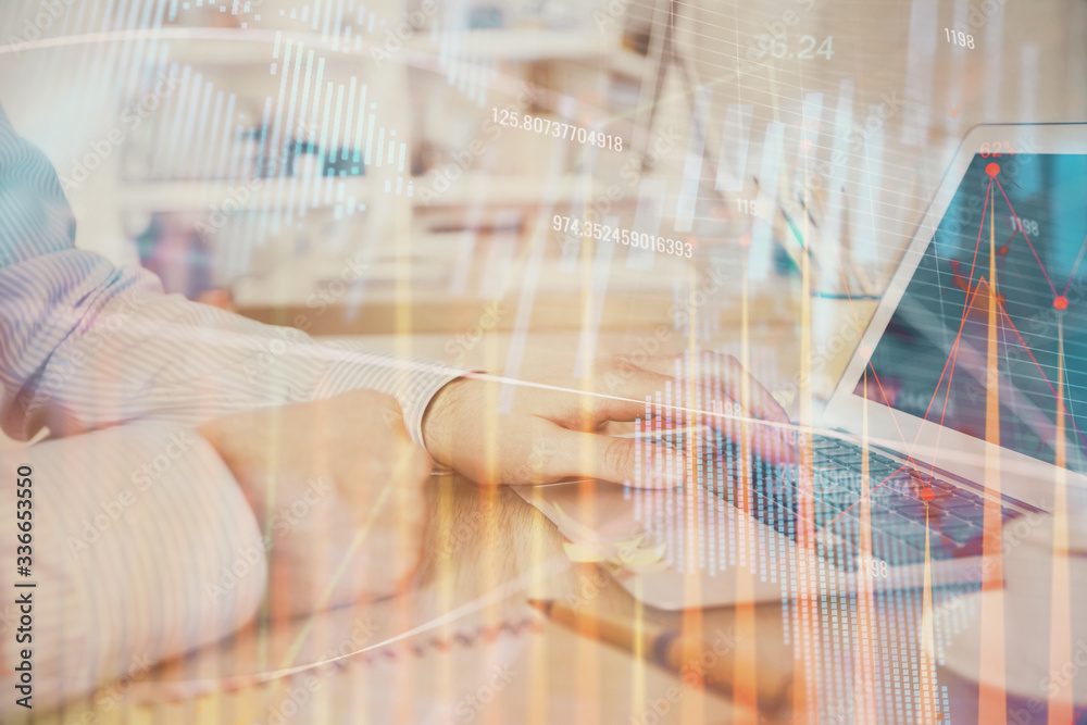 Multi exposure of stock market chart with man working on computer on background. Concept of financial analysis. Multi exposure of stock market chart with man working on computer on background. Concept of financial analysis.