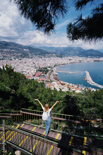 Traveling by Turkey. Young woman  on Alanya city view point. photo