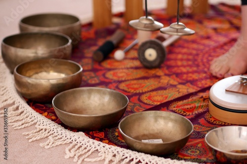 Tibetan singing bowls close up for a sound healing therapy session.