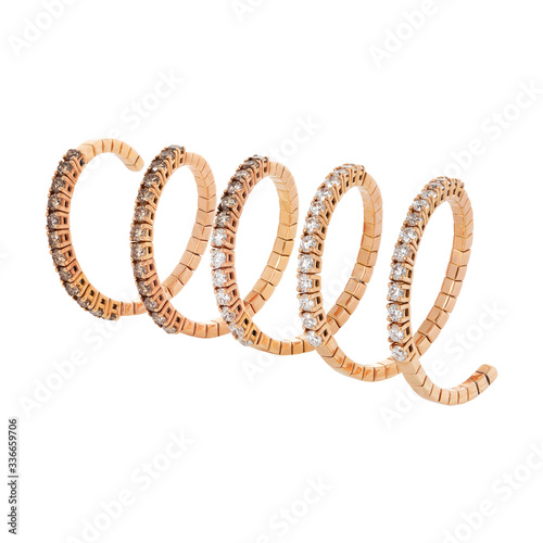 Rose gold ring with white and cognac diamonds isolated on white background