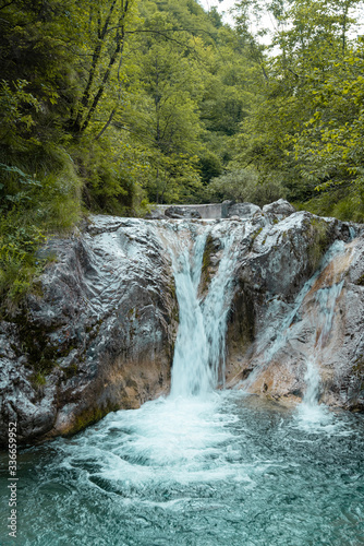 Waterfall at the Val Vertova Torrent Lombardy near Bergamo in Italy in the middle of the Orobiche mountains.