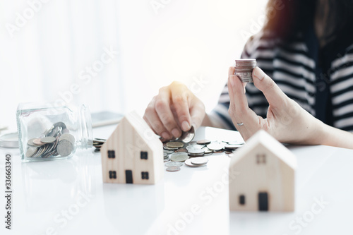 Woman's hand saving a coin ...