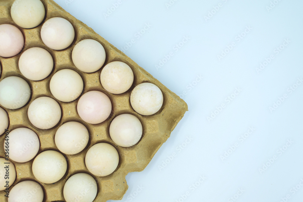 top view of raw eggs row with white background. top view of raw eggs row with white background.