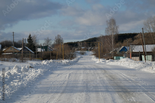 Snow road in the village