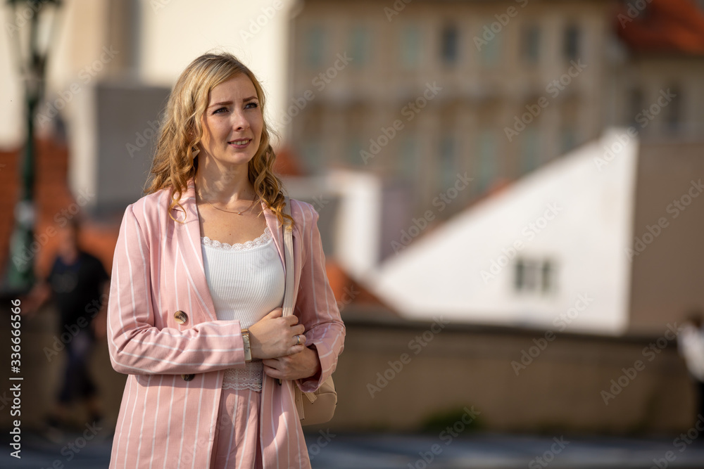 Young blonde woman exploring old town of Prague in sunny day, Czech republic Young blonde woman exploring old town of Prague in sunny day, Czech republic