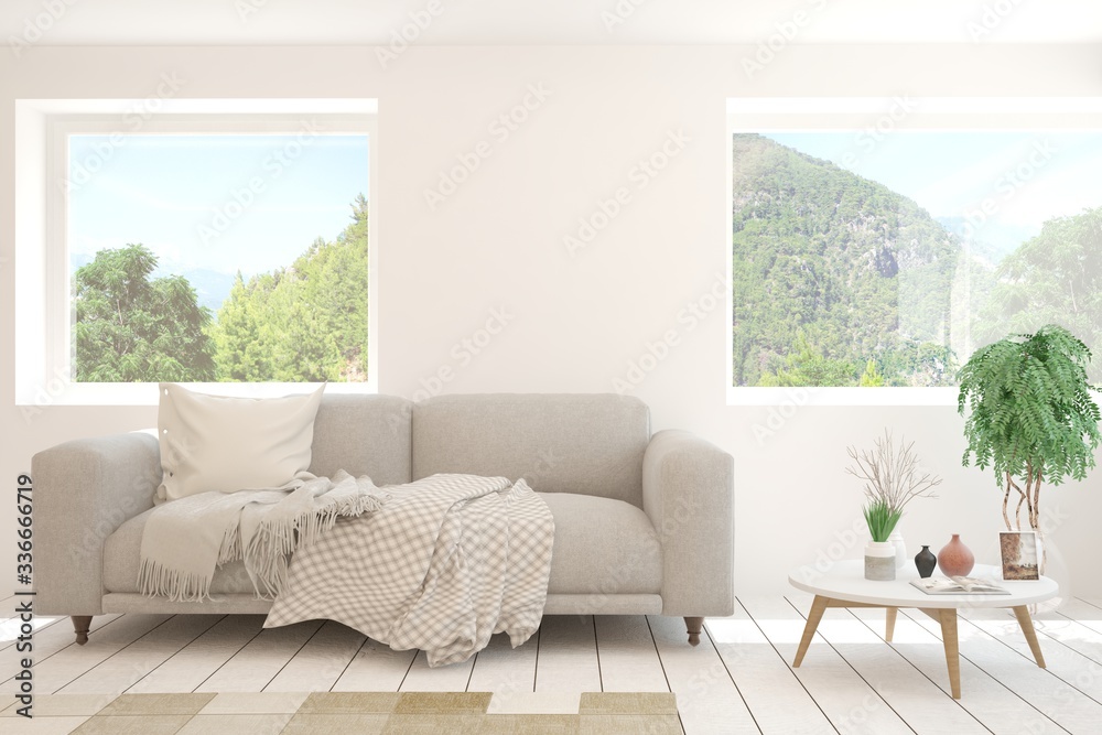 Fototapeta premium White living room with sofa and summer landscape in window. Scandinavian interior design. 3D illustration