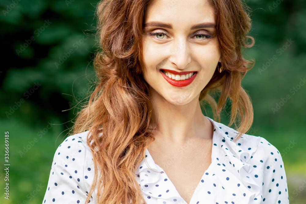 Portrait of beautiful young smiling woman on green background of summer nature. Portrait of beautiful young smiling woman on green background of summer nature.
