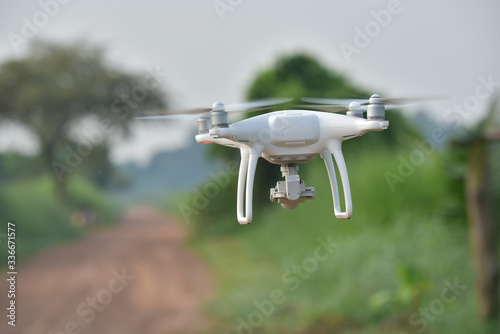 Drone fly above green corn field.The concept of using aircraft inspects Corn farm