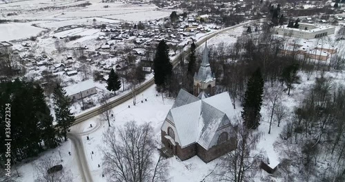 Flight over the Church in Melnikovo in winter. Leningrad region photo