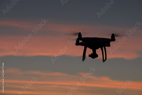 Flying drone above the professional camera takes pictures of the Sky © AlexPhototest