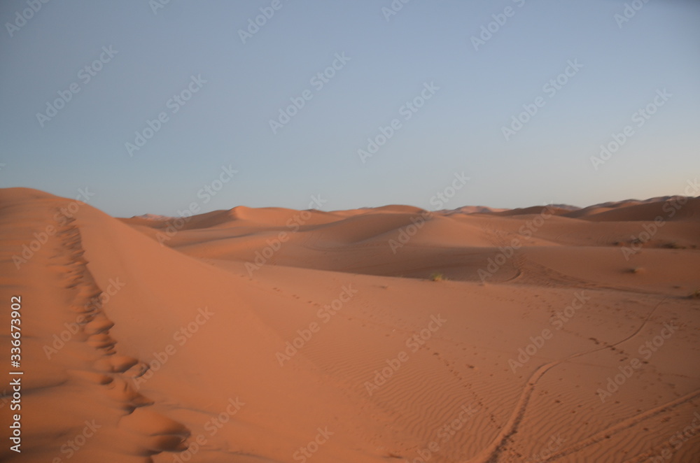 Merzouga is a small Moroccan town in the Sahara Desert, near the Algerian border. Merzouga is a small Moroccan town in the Sahara Desert, near the Algerian border.