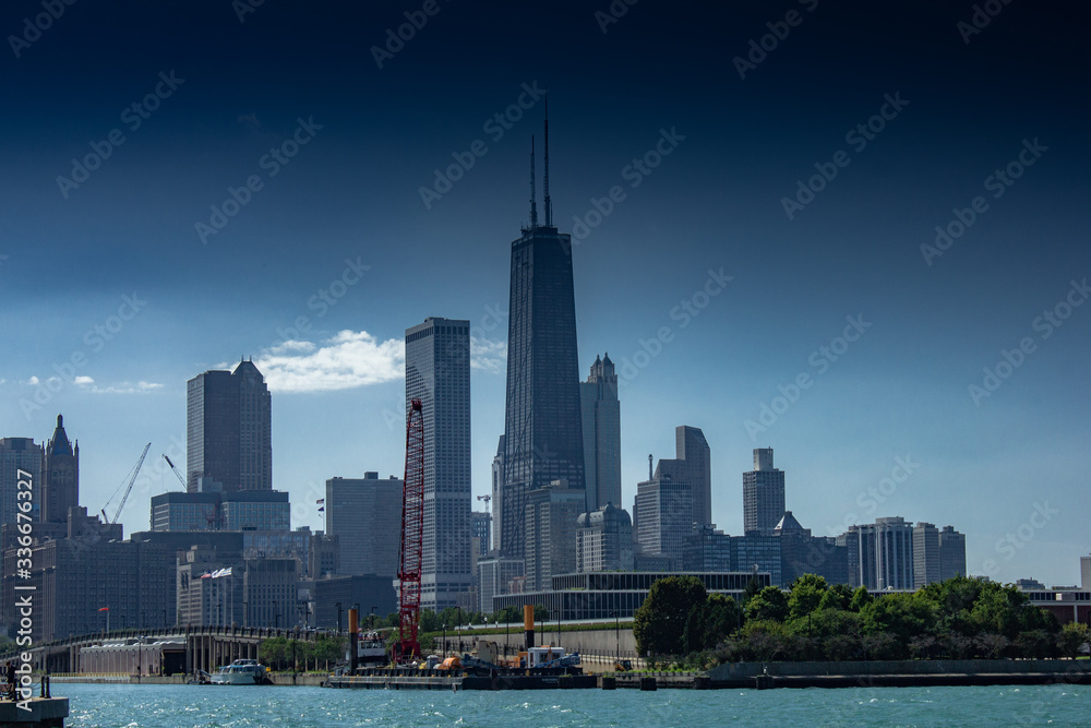 Chicago in summer with clear skies with buildings and greenery Chicago in summer with clear skies with buildings and greenery