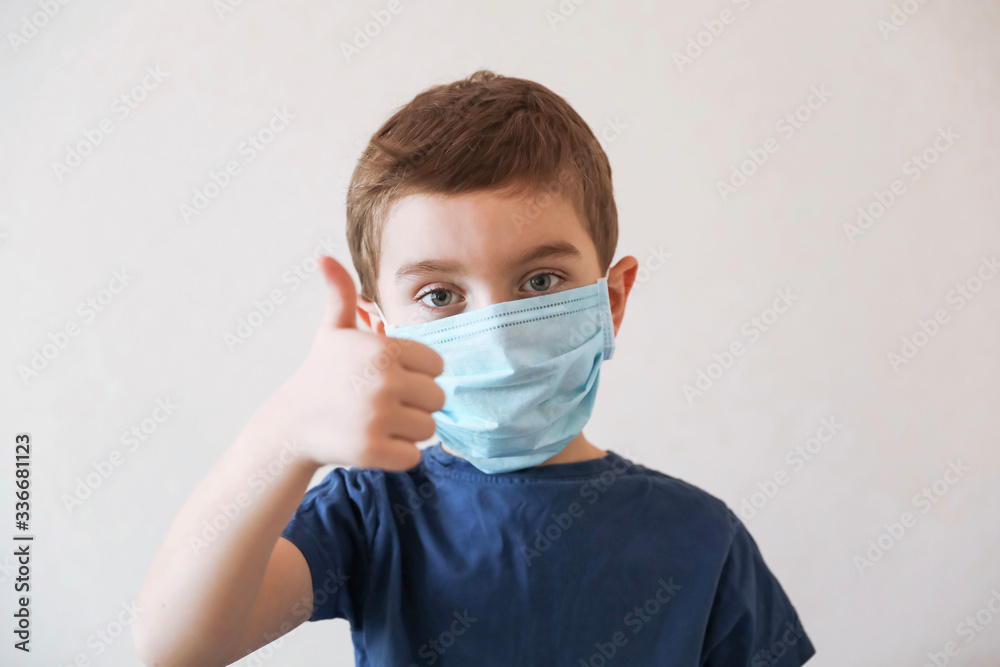 Coronavirus and Air pollution concept. Little boy wearing mask for protect and show thumbs up gesture for good air at home. Coronavirus and Air pollution concept. Little boy wearing mask for protect and show thumbs up gesture for good air at home.