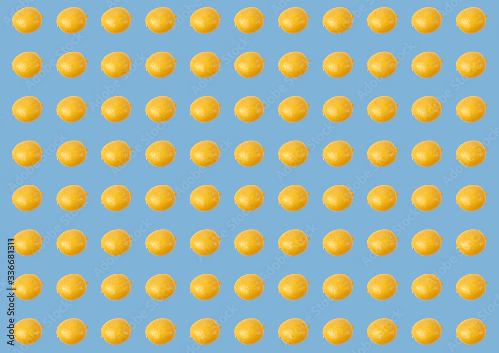 Fresh lemon pattern on a bright blue background of flat masonry