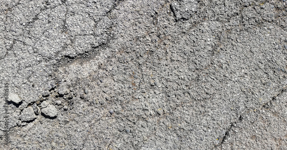 texture of old cracked asphalt surface background
