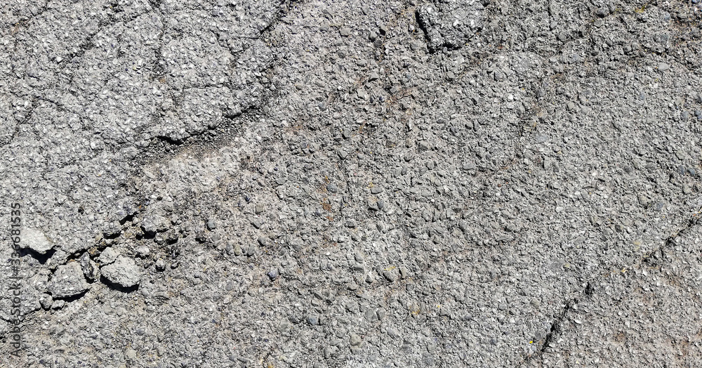 texture of old cracked asphalt surface background
texture of old cracked asphalt surface background