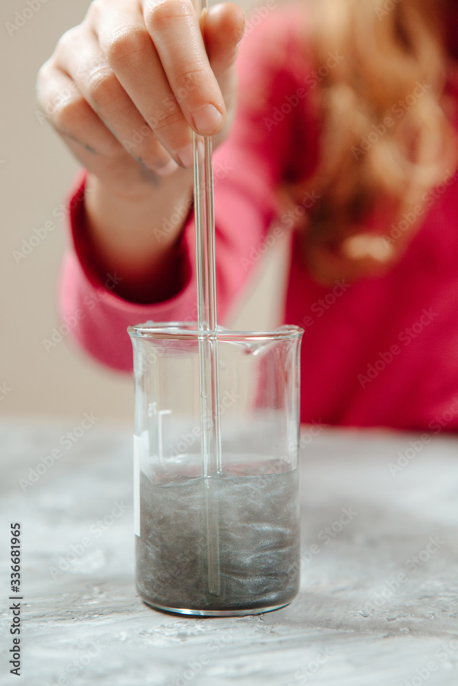 Woman's hand mixing skincare with herbal essence, preparing organic raw materials for beauty products. Handmade beauty treatment. Woman's hand mixing skincare with herbal essence, preparing organic raw materials for beauty products. Handmade beauty treatment.