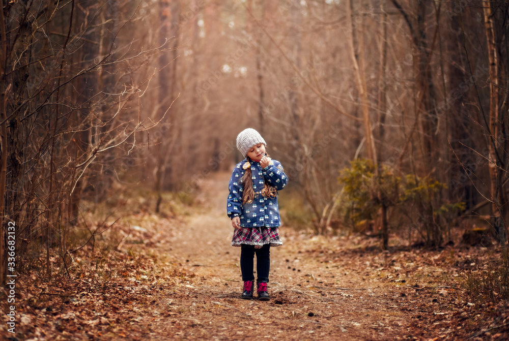 little cute girl in the spring forest little cute girl in the spring forest