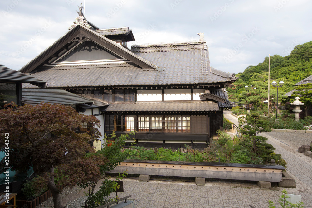  a traditional style japanese house in a garden