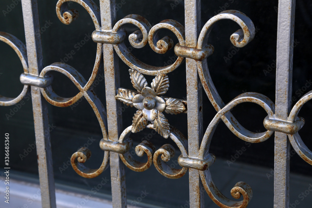 Metal fence. Metal curly fence in the park Metal fence. Metal curly fence in the park